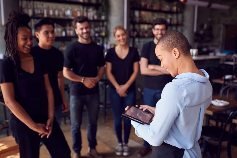 restaurant employees discussing tipping solution