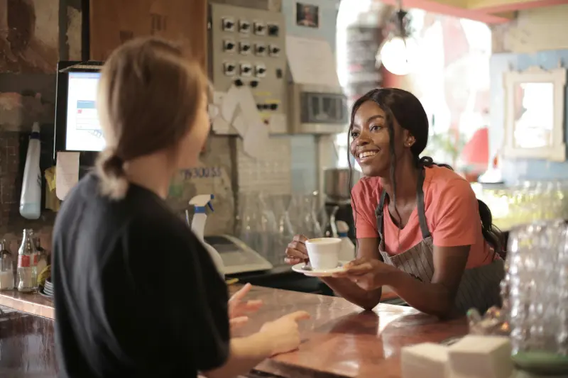 a tipped employee serving a customer in a restaurant